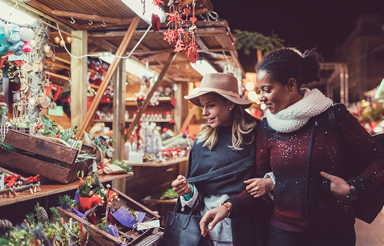 Two ladies at an outdoor holiday market